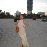 Vestido Longo de Tricô com Trama Vazada, Frente Única e Barra de Franjas Assimétrica – Savane